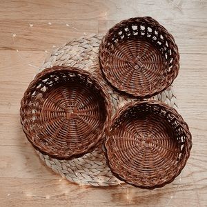 Set of three brown vintage wicker nesting baskets